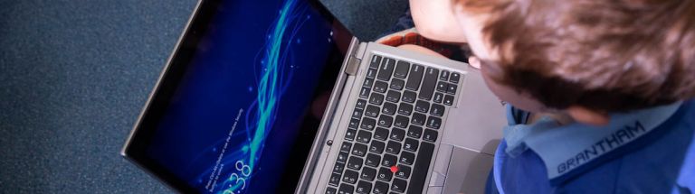 A child working on a laptop