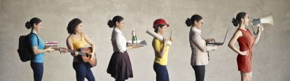 Students in a line, each personifying a different career, e.g. musician, waiter, construction worker